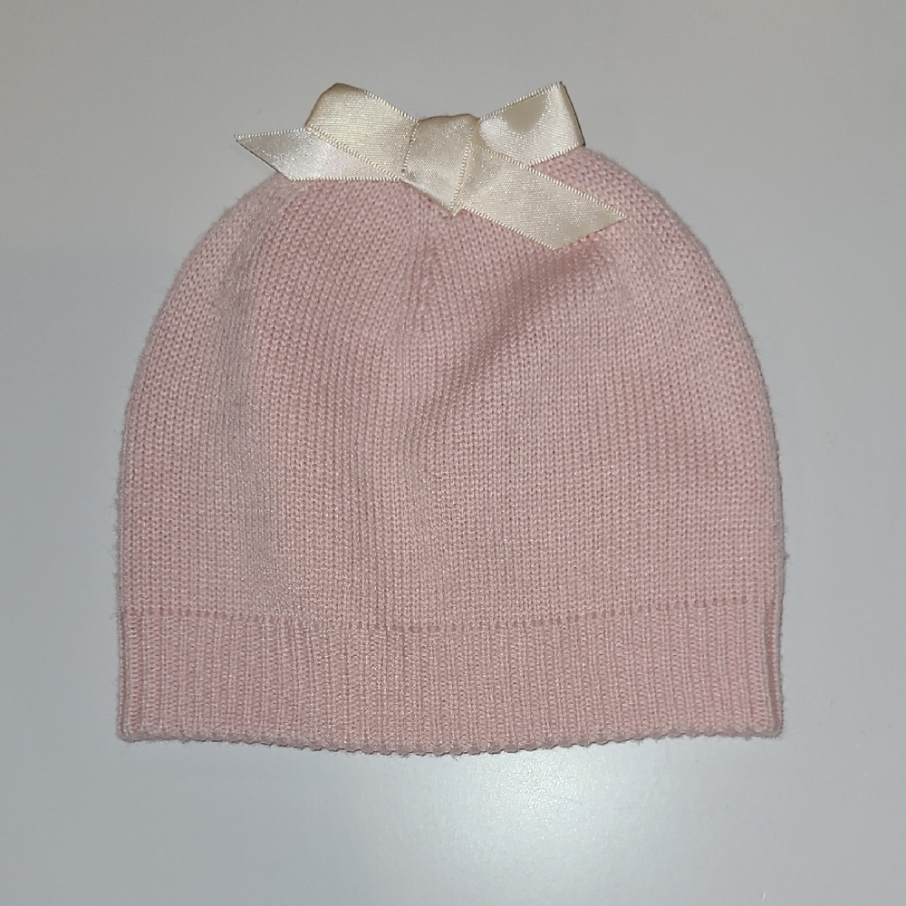UGG  Chic pink knit beanie. Soft and stylish for any occa